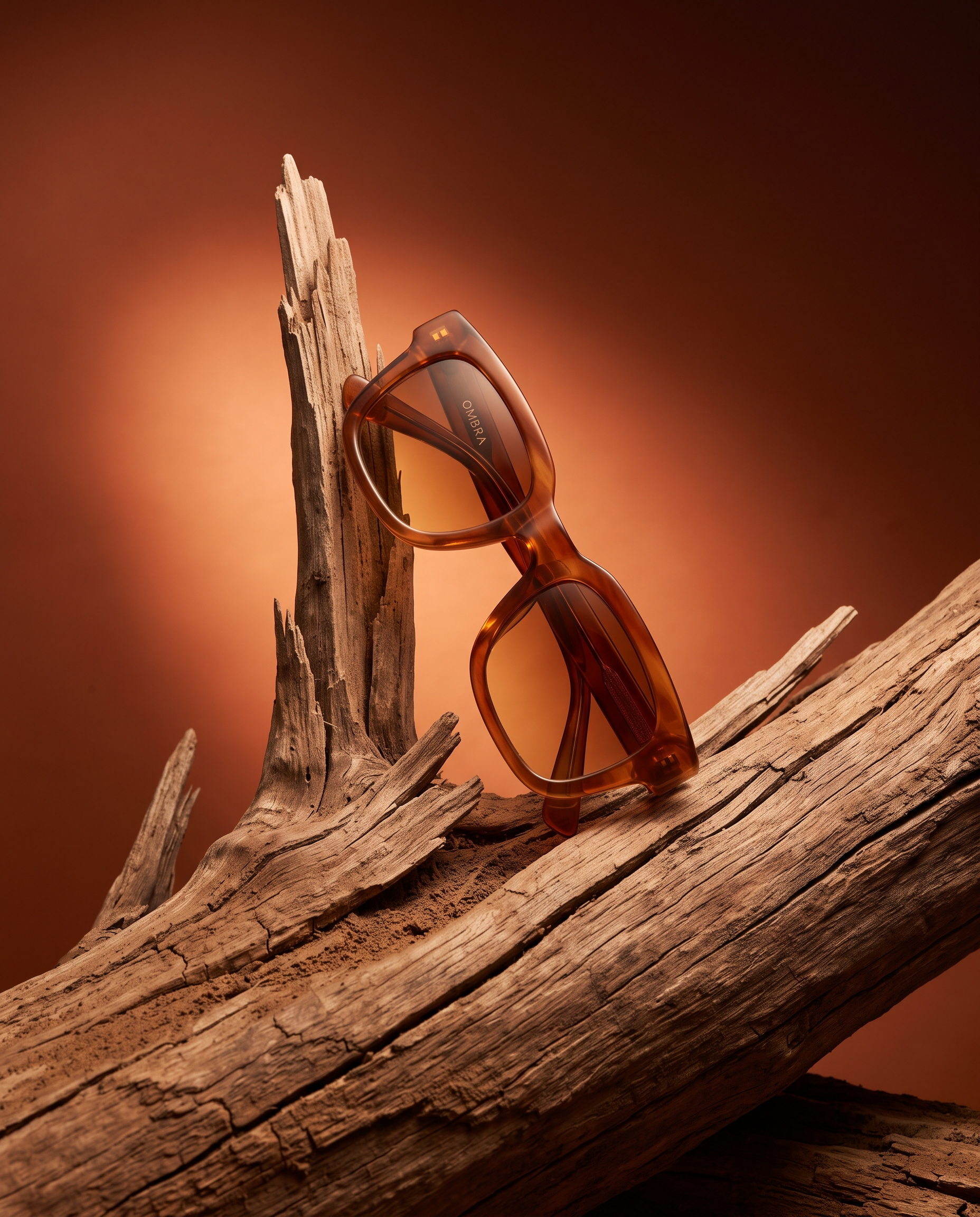 AI-generated: Vertical 4:5 editorial product photograph of designer sunglasses for the fictional eyewear brand "OMBRA". Chunky retro acetate sunglasses in