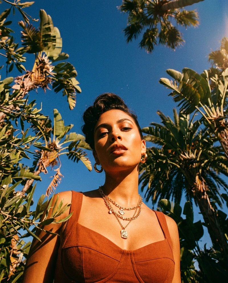 AI-generated: A woman with her hair styled up, adorned with earrings and a necklace, captured from an extreme low-angle, worm's-eye perspective looking di